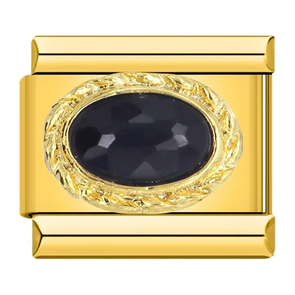 Gold mit schwarzem Stein